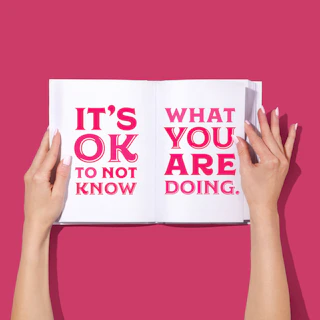 person holding white and red love you print paper