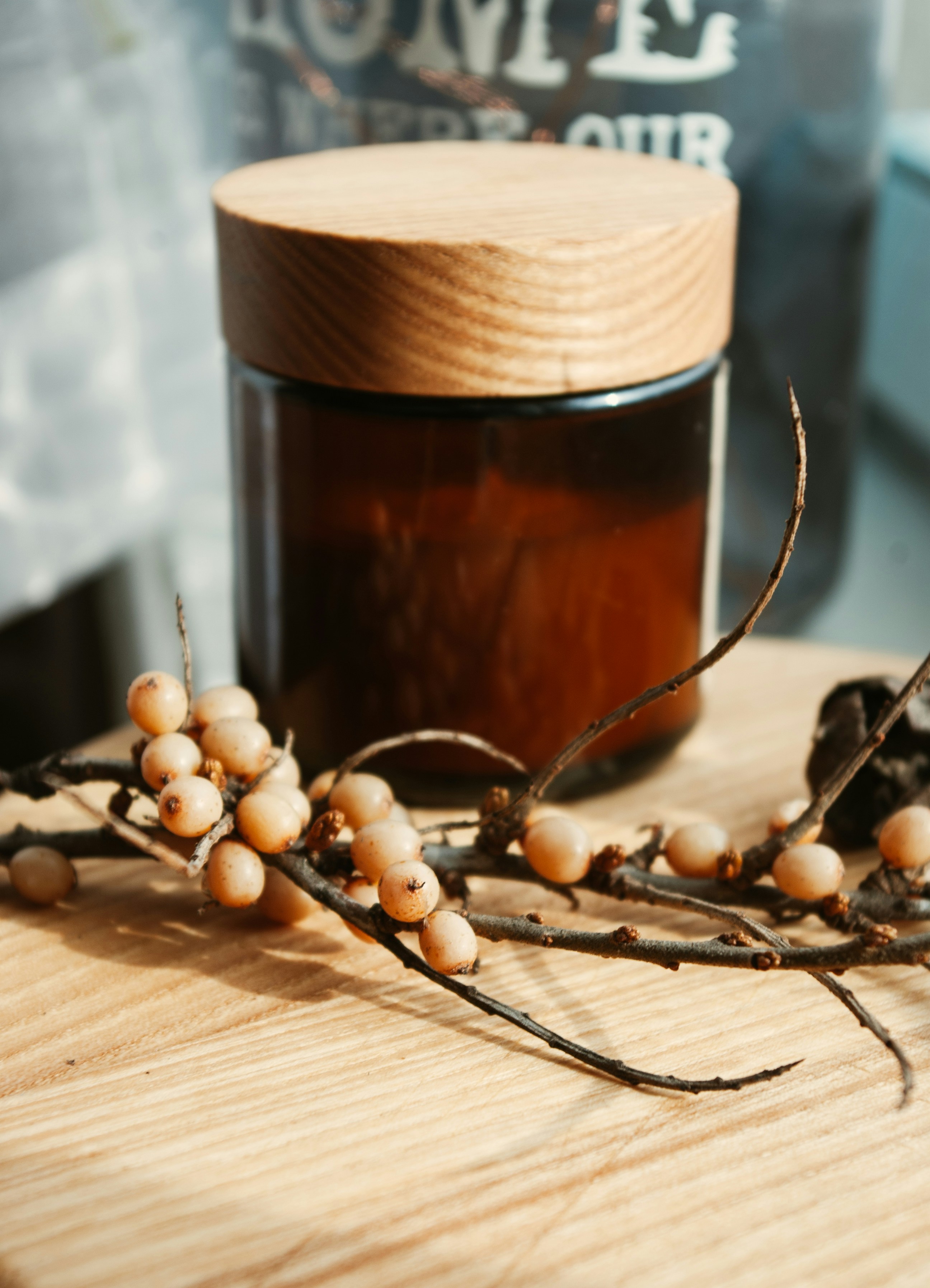 brown glass bottle on brown wooden table
