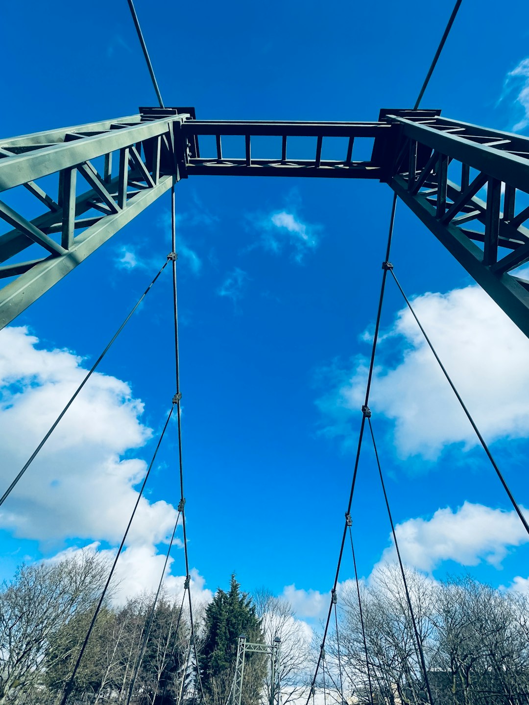 black metal bridge under blue sky during daytime