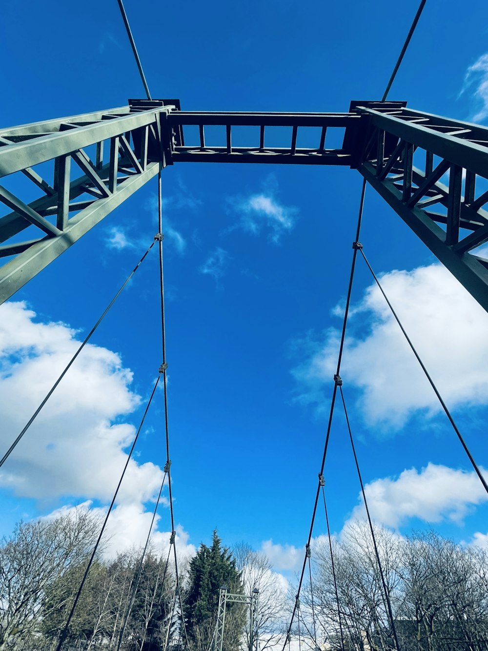 black metal bridge under blue sky during daytime