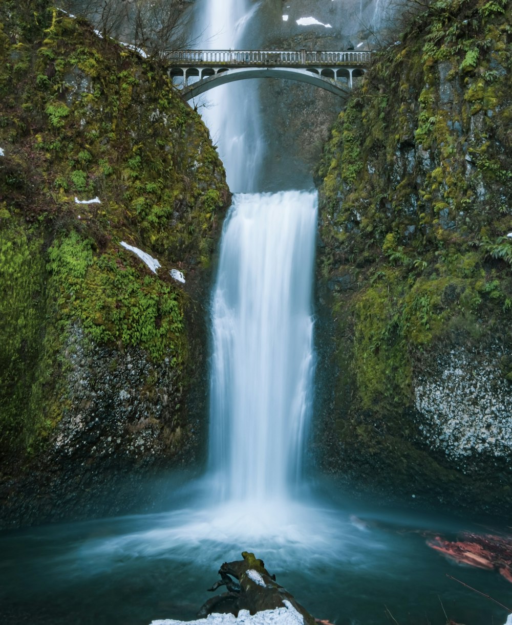 white bridge over water falls