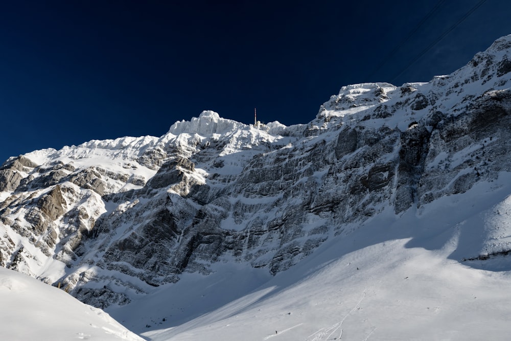 snow covered mountain under blue sky during daytime