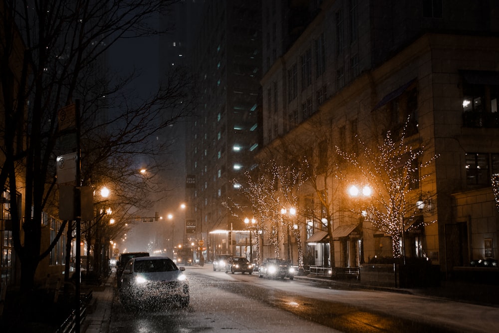 black car on road during night time