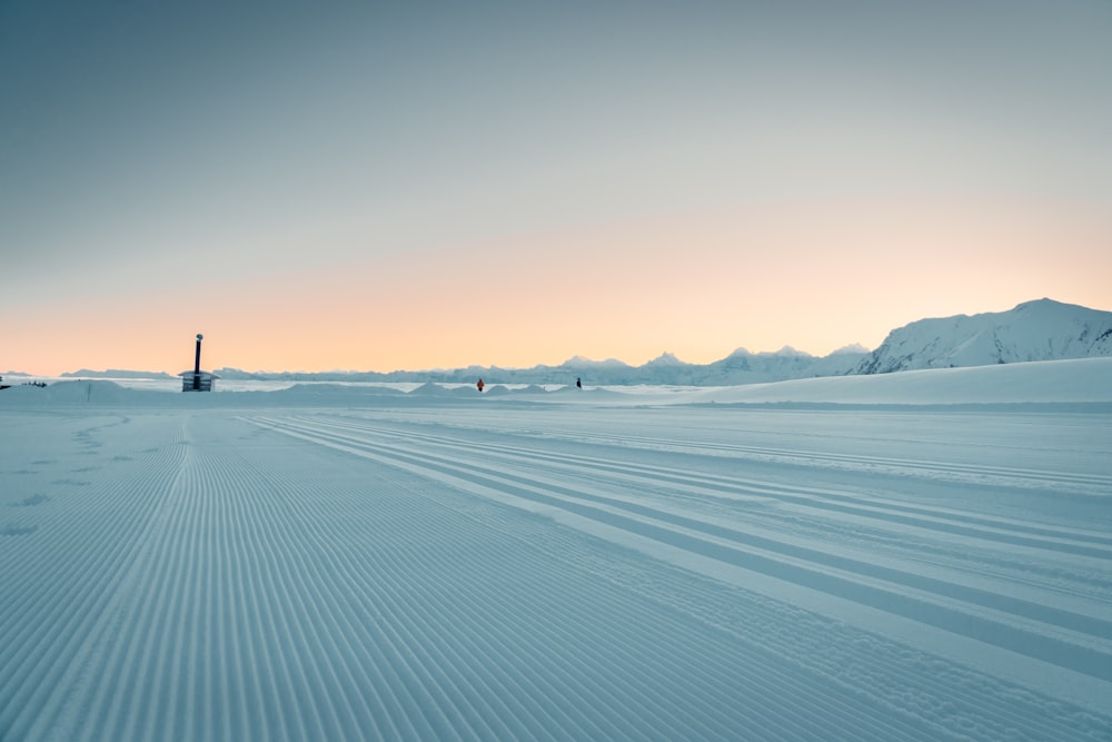 black house on snow covered ground during daytime