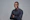 man in black dress shirt wearing black framed eyeglasses