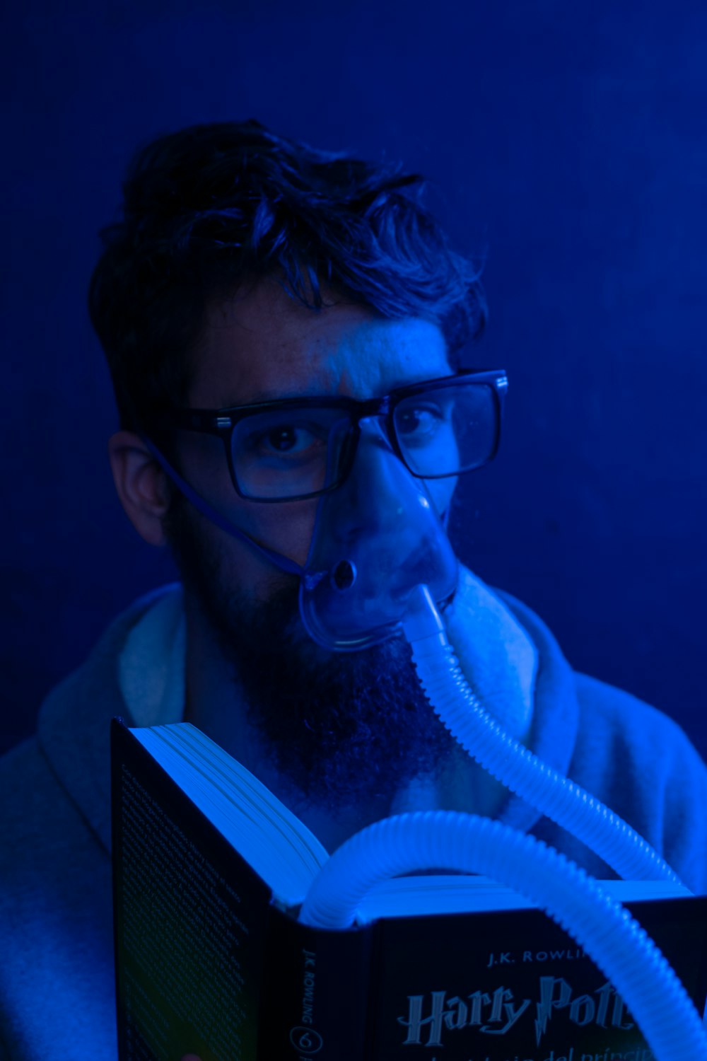 man in black framed eyeglasses and white jacket