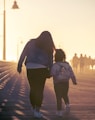 2 women walking on the road during daytime