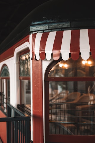 A beautifully decorated Tonkin Heritage Express train cabin showcasing traditional Vietnamese motifs and warm lighting.