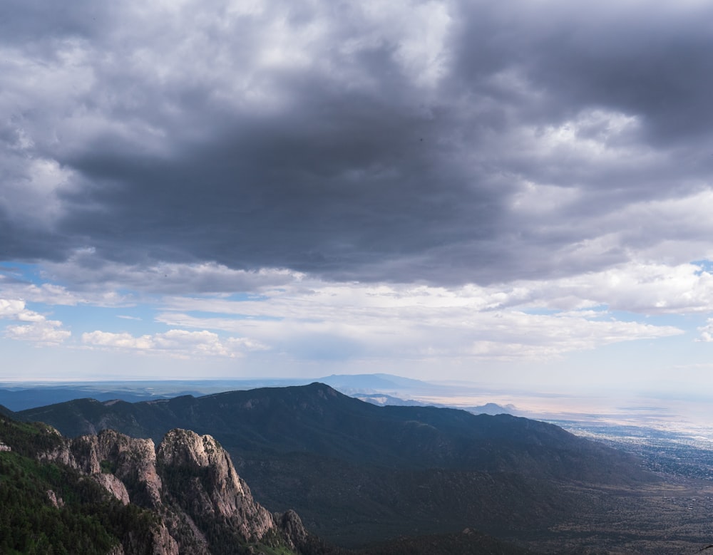 green mountains under white clouds during daytime