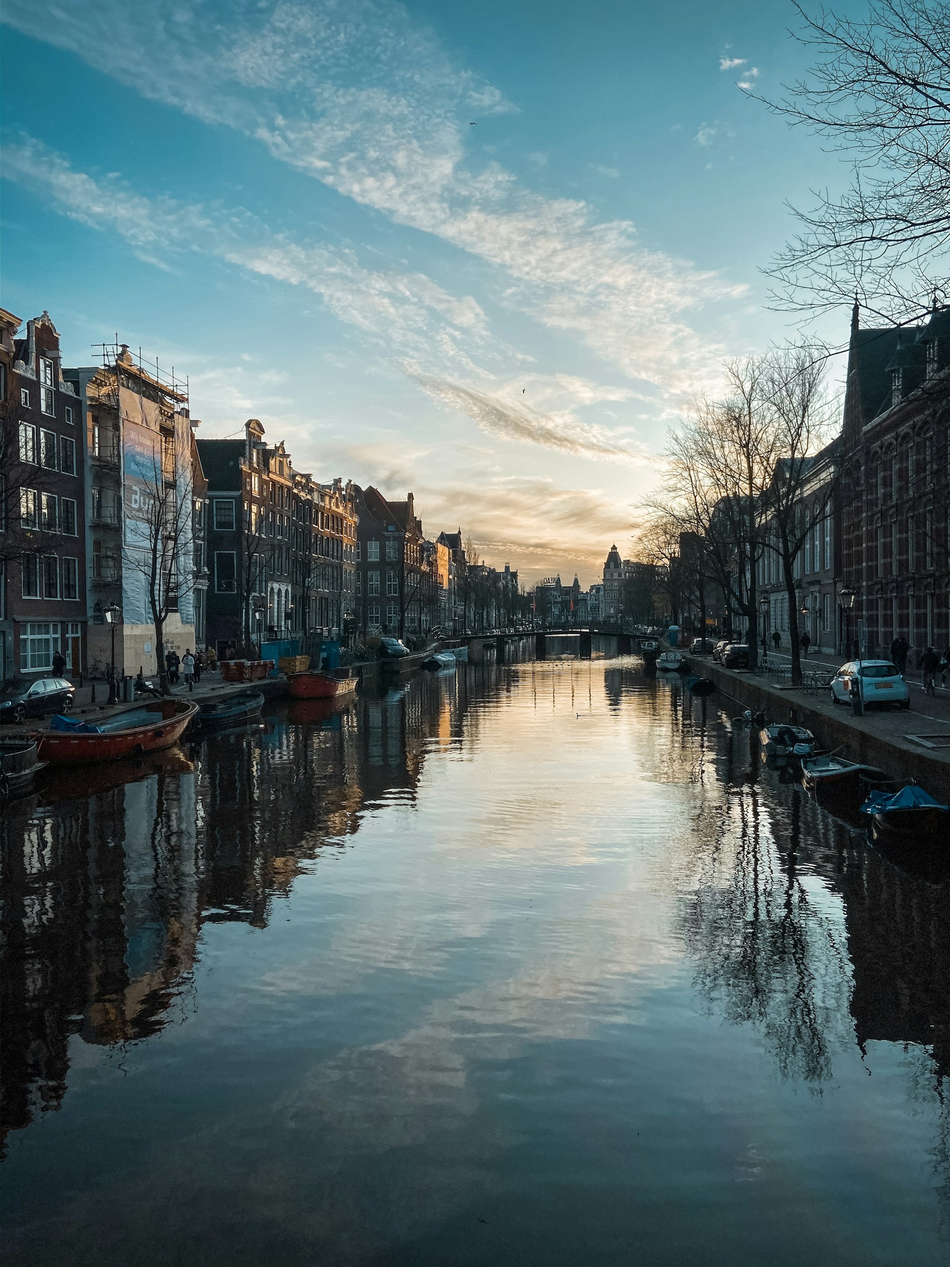 body of water between buildings during daytime