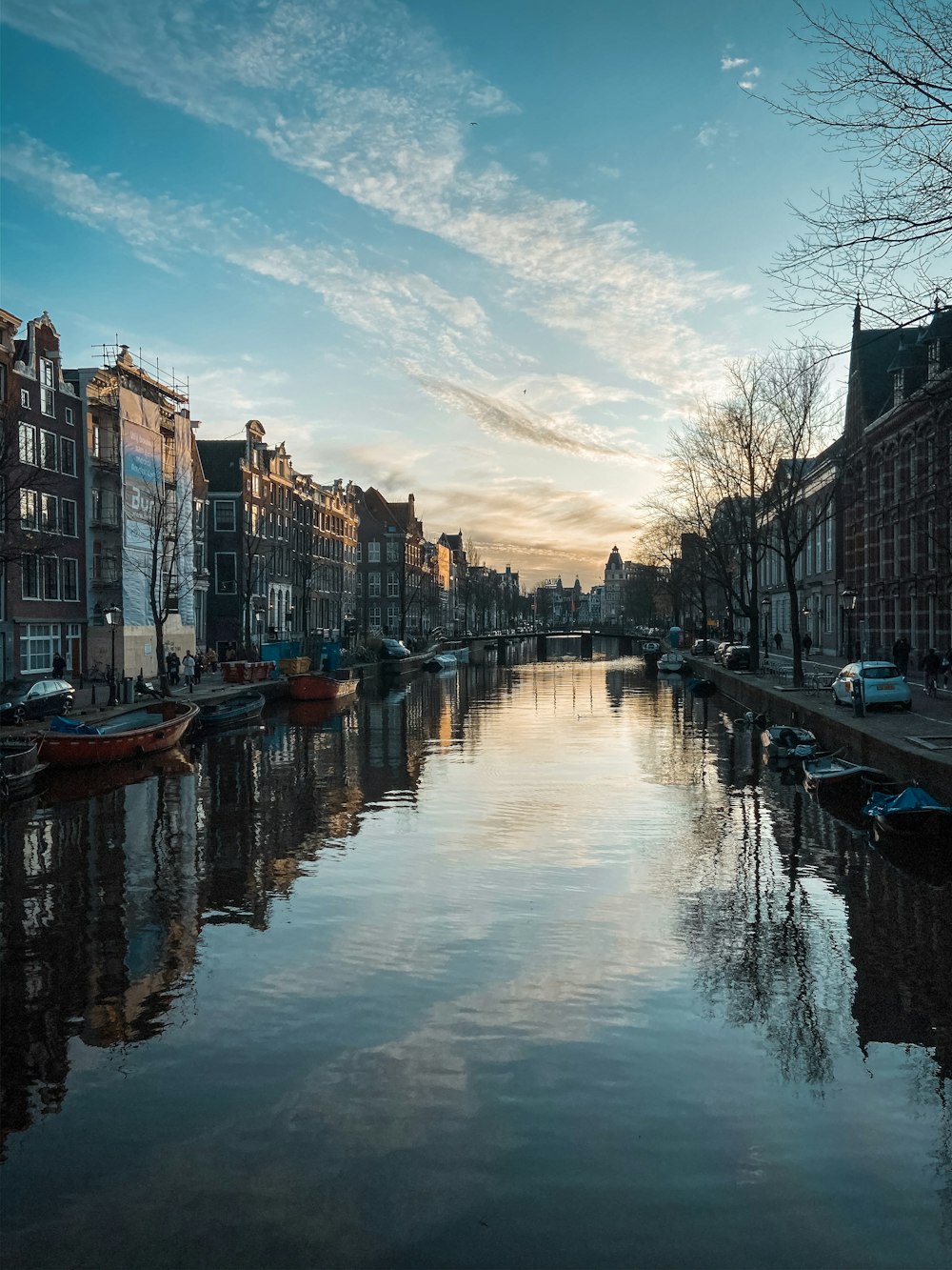 body of water between buildings during daytime