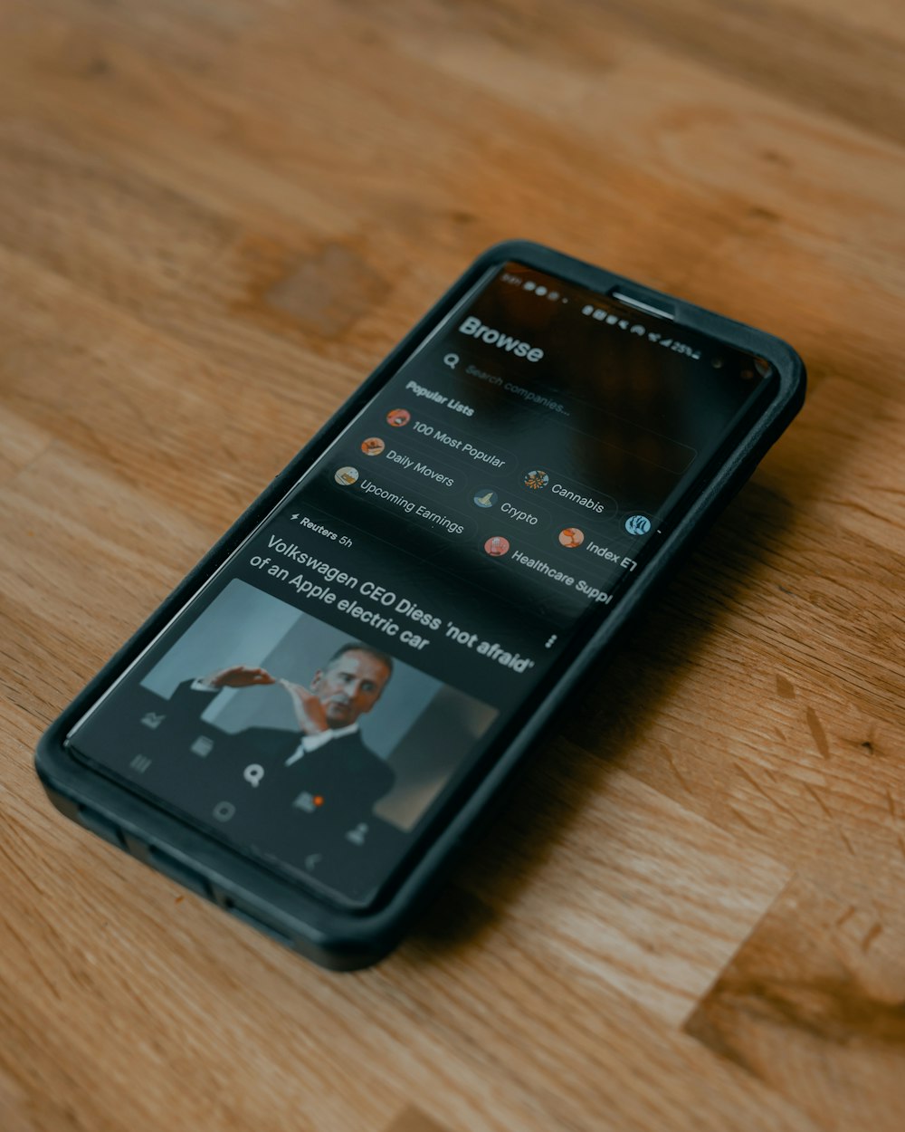 black android smartphone on brown wooden table