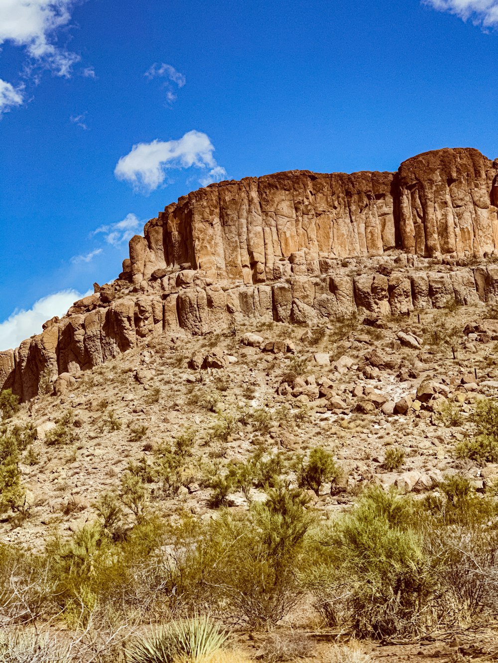 brown rocky mountain under blue sky during daytime