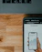 Close-up of hands holding a smartphone showing a simple investment app dashboard.