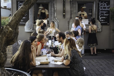 people sitting on chair in front of table