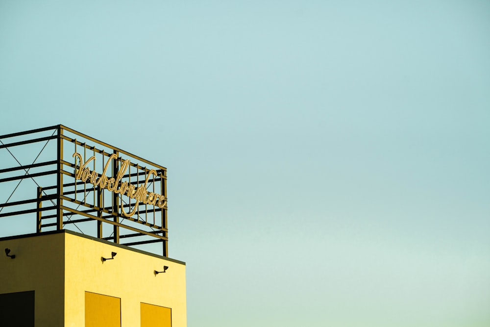 yellow concrete building under white sky during daytime