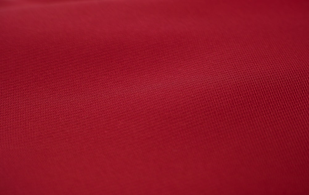 red textile in close up photography