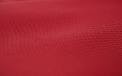 red textile in close up photography tablecloth zoom background