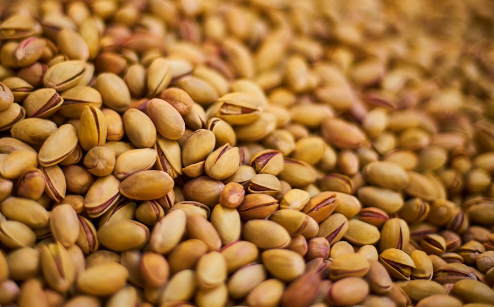 brown and beige nuts on brown wooden surface