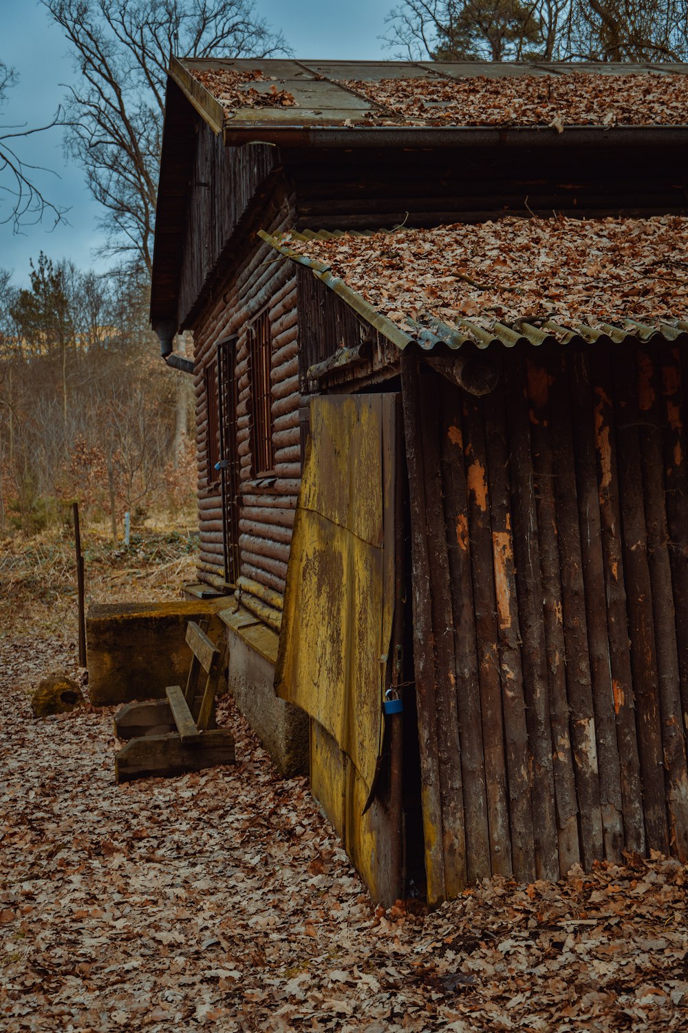 brown wooden house near trees during daytime