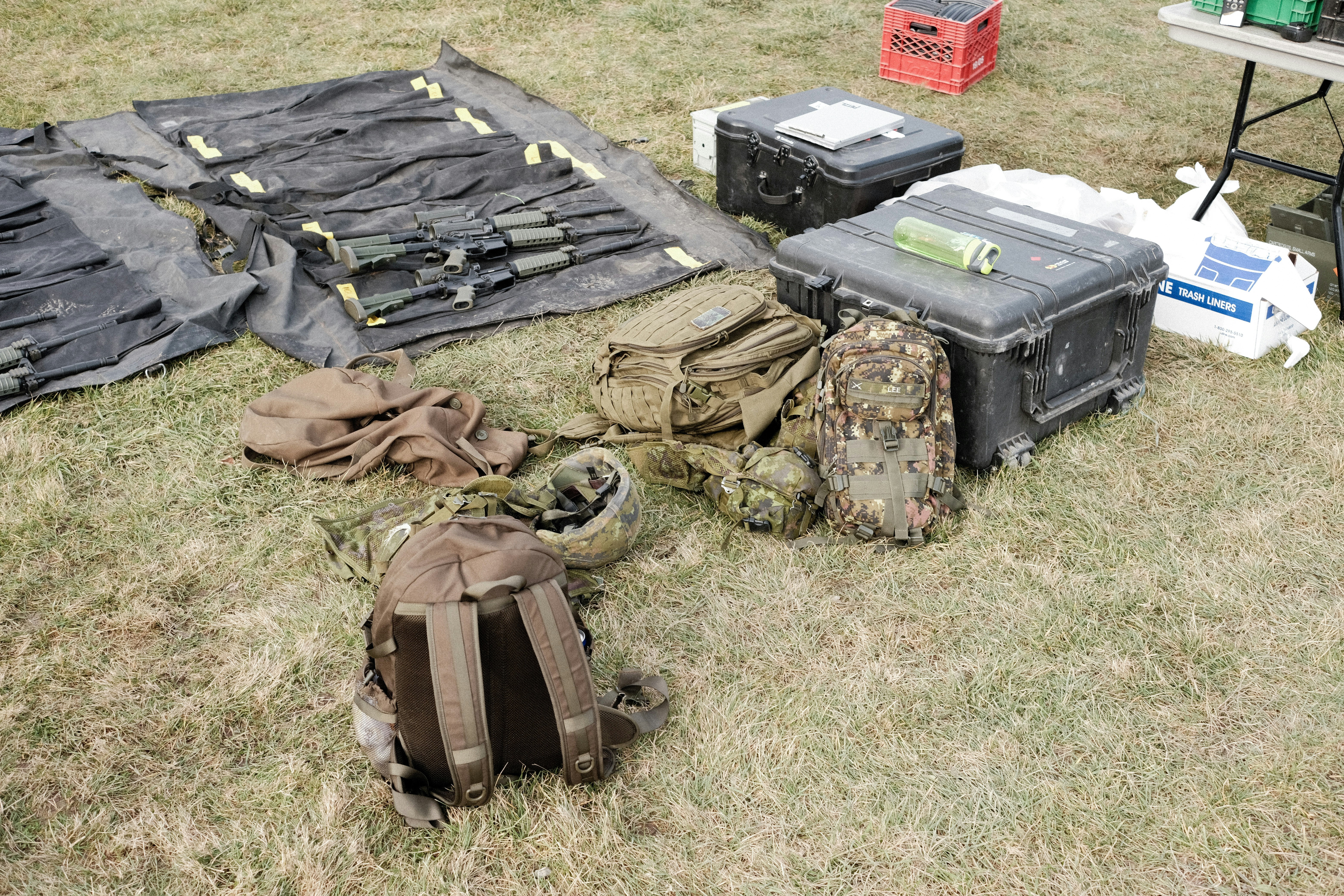 Black and gray backpack on green grass field