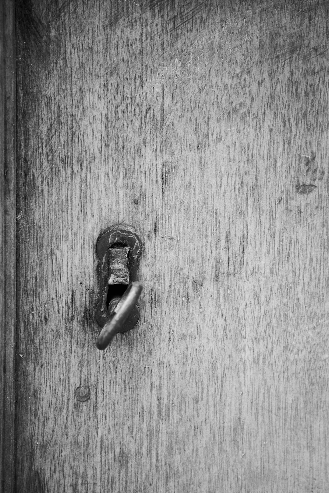 black padlock on wooden surface