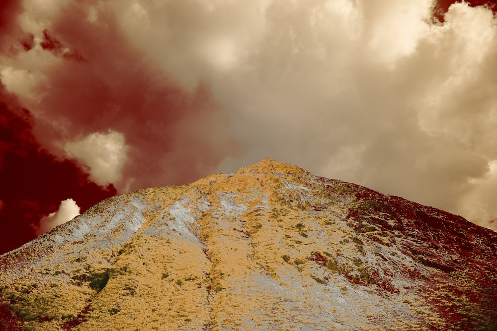 green and white mountain under white clouds