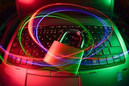 A professional locking shield icon glowing in dark purple hues symbolizing cybersecurity.