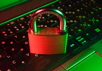 red padlock on black computer keyboard