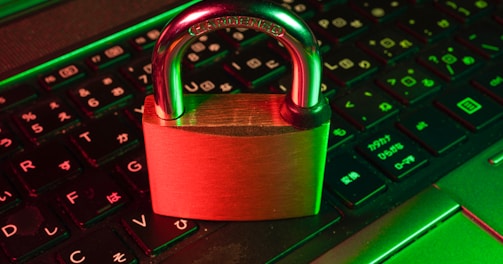 red padlock on black computer keyboard