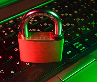 red padlock on black computer keyboard