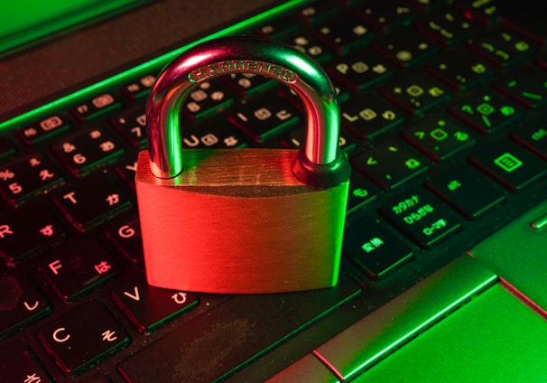 red padlock on black computer keyboard