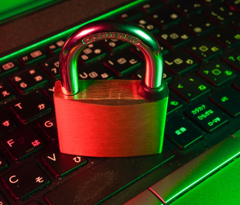 red padlock on black computer keyboard