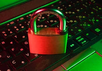 red padlock on black computer keyboard