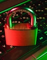 red padlock on black computer keyboard