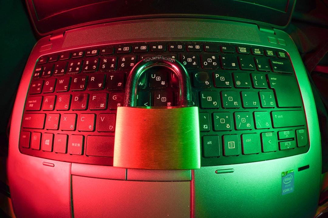 pink and silver padlock on black computer keyboard, Cyber security image<p></figure>