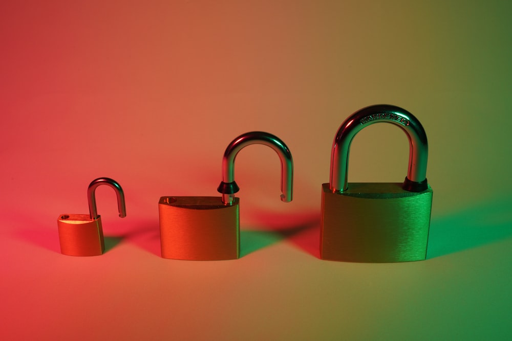 two pink and silver padlock