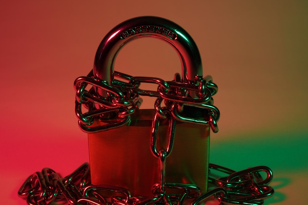 red padlock on red metal chain