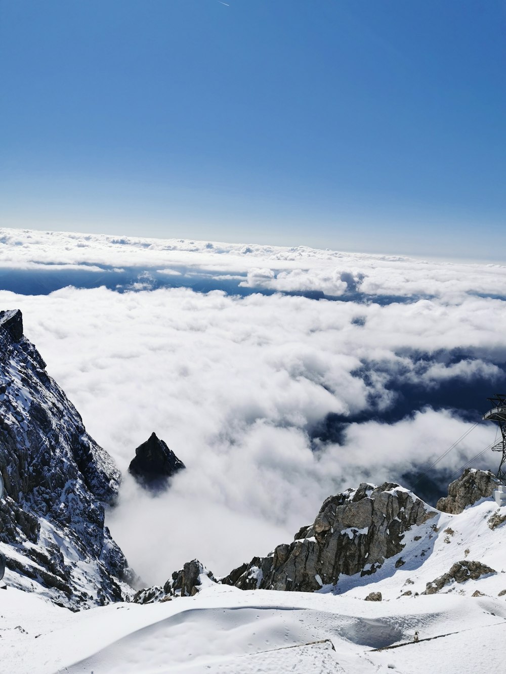 snow covered mountain under blue sky during daytime