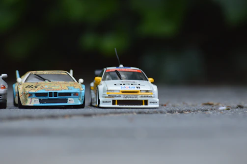 Two cars side by side on a test track ready for comparison