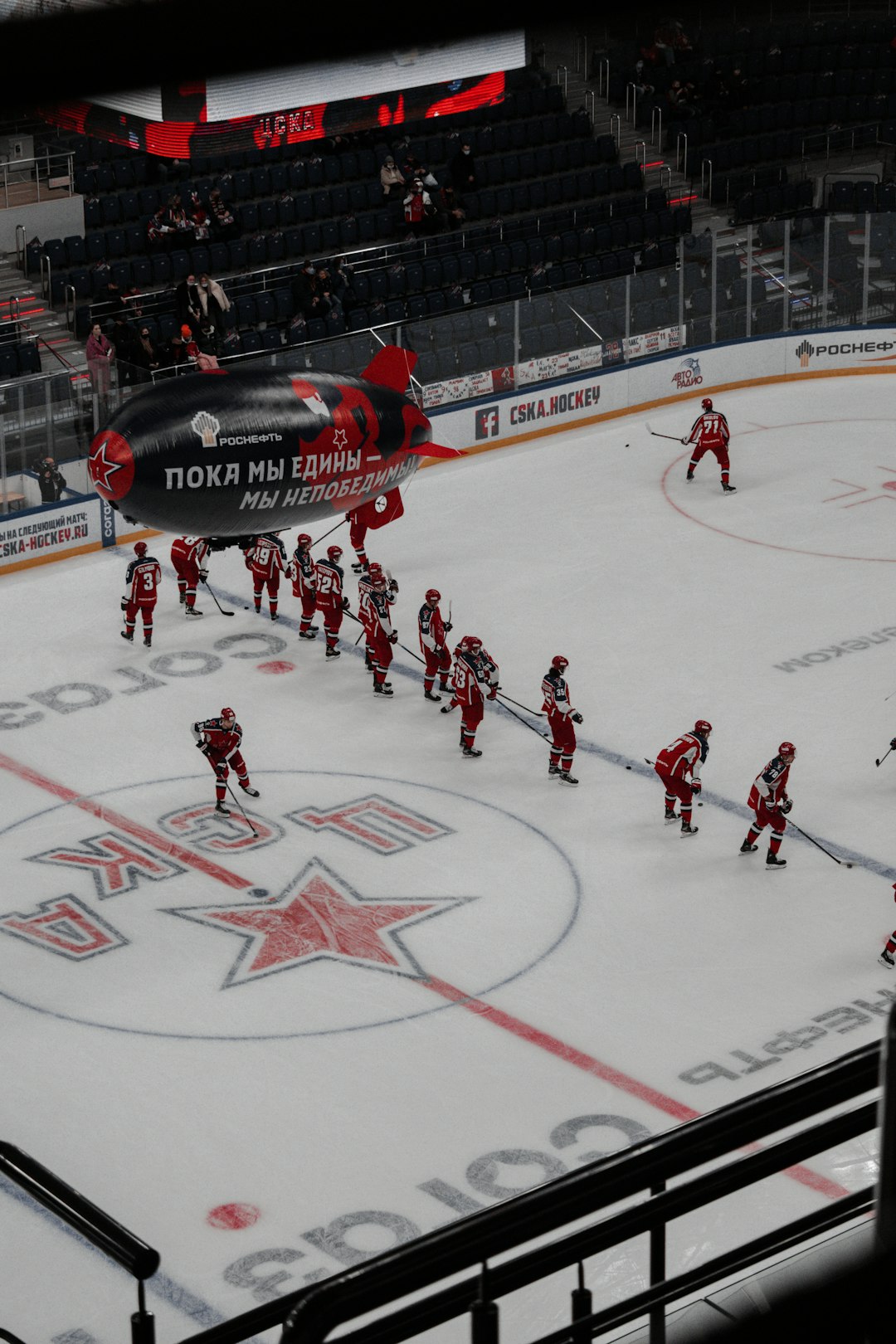 people playing ice hockey on stadium