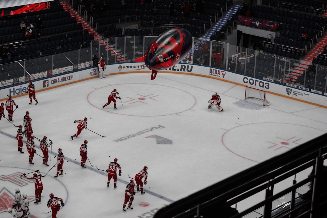 people playing ice hockey on ice stadium