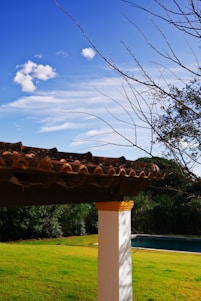 A serene Florida home with a freshly cleaned porch under a clear blue sky.