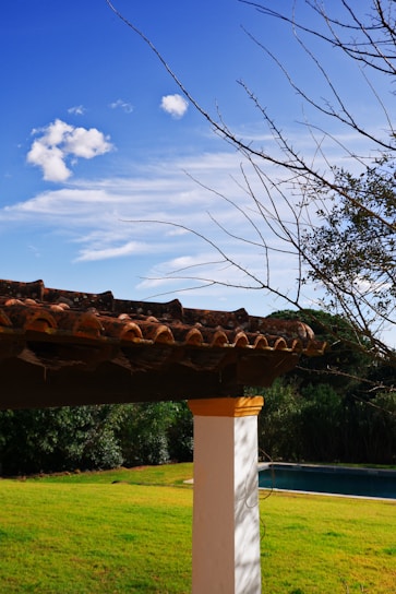 A serene Florida home with a freshly cleaned porch under a clear blue sky.