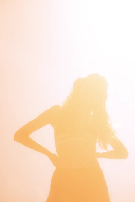 Woman with a confident, natural posture representing body wellness