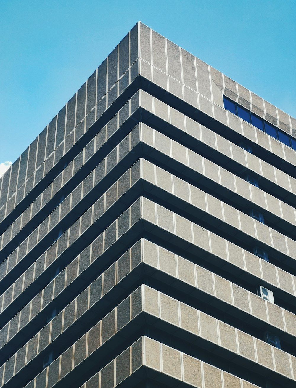 white concrete building under blue sky during daytime