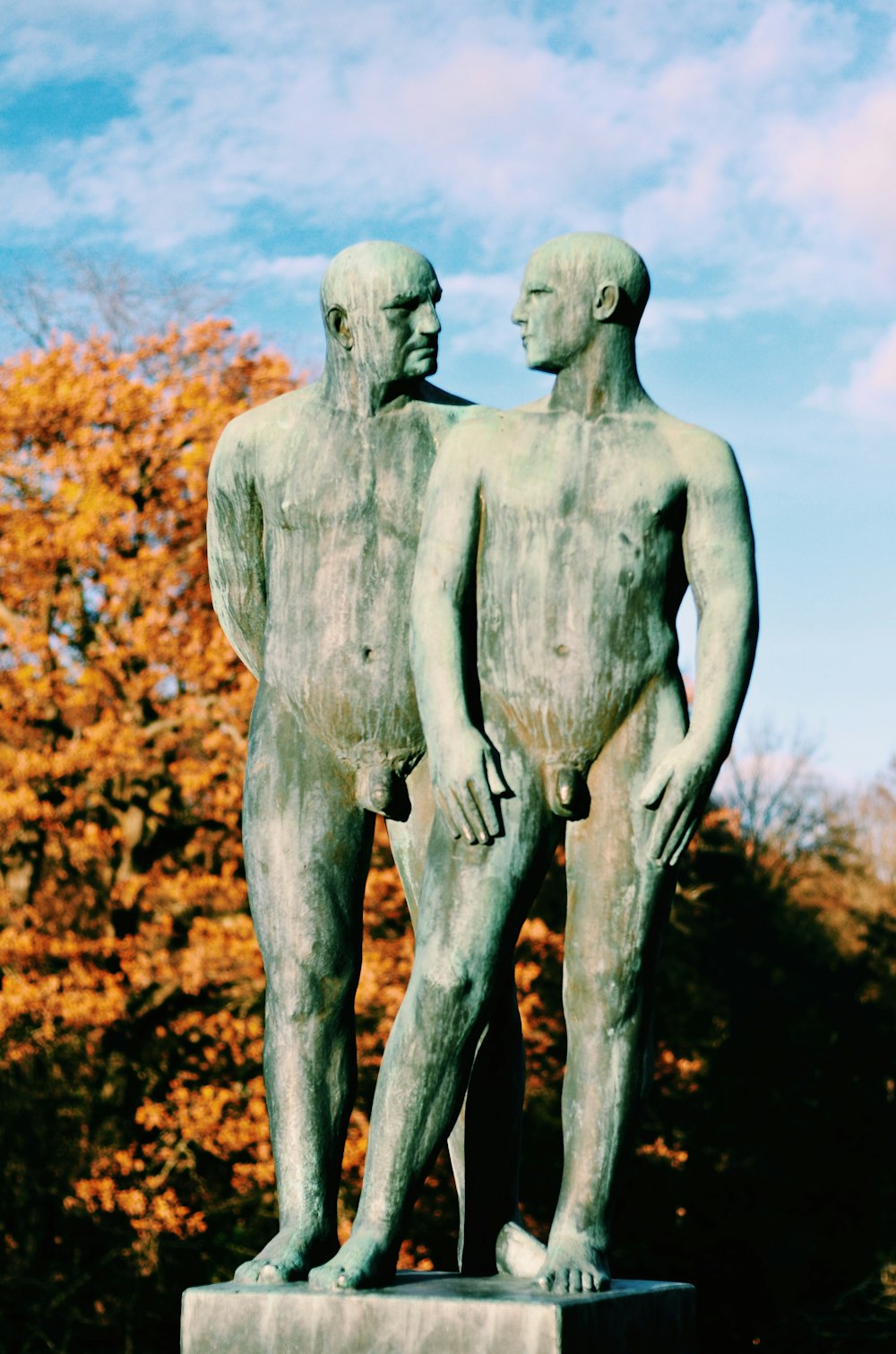 white concrete statue of a man