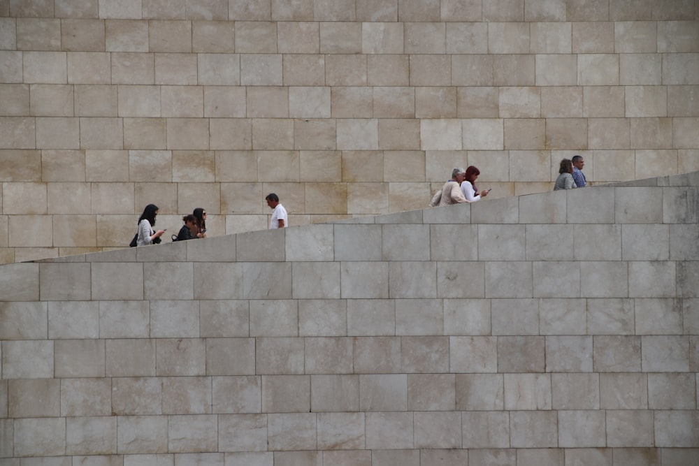 people sitting on concrete stairs