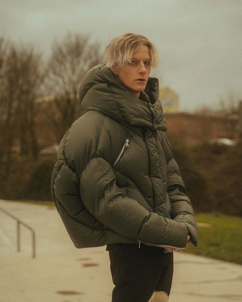 woman in a dark puffer jacket on a snowy day