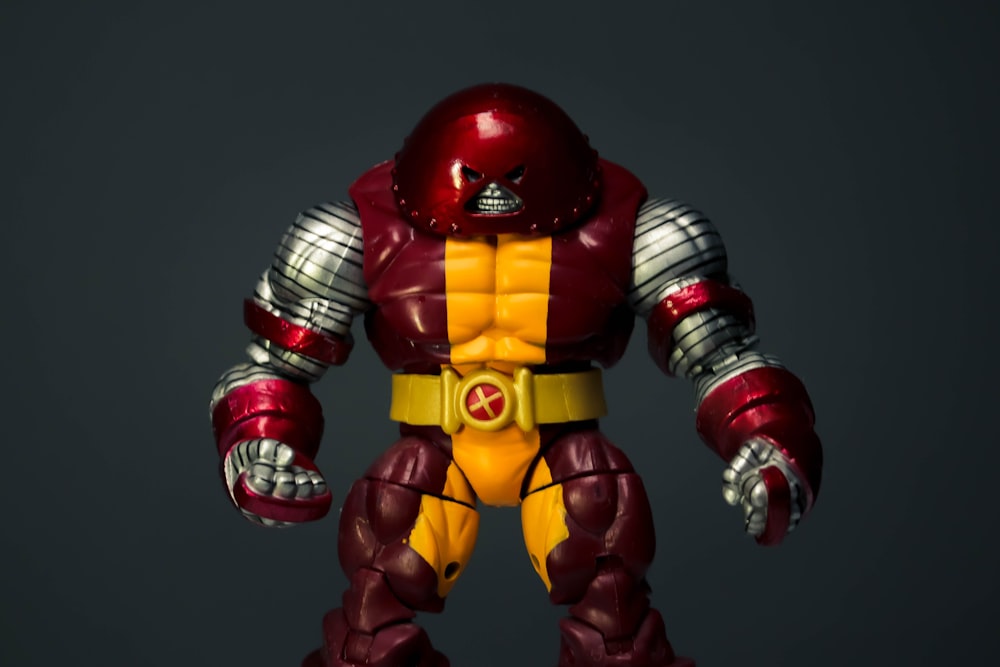 red and yellow iron man action figure